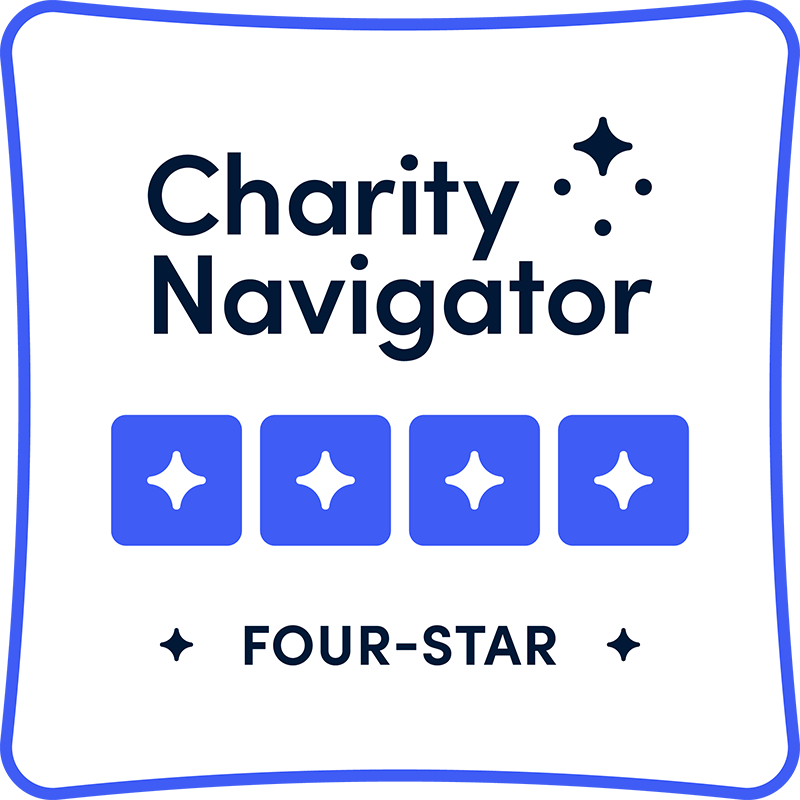 Charity Navigator four-star rating badge with blue stars and text on a white background.