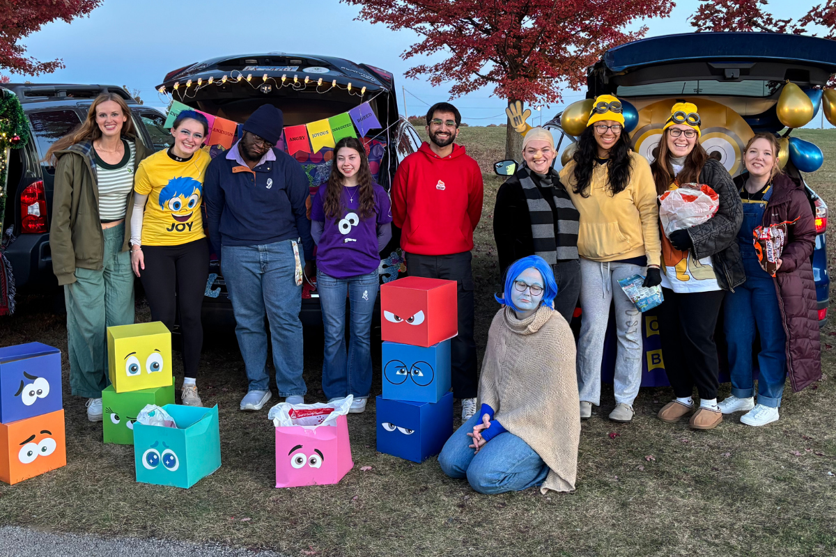 Trunk or treat, two trunks decorated as minions and movie characters from inside out