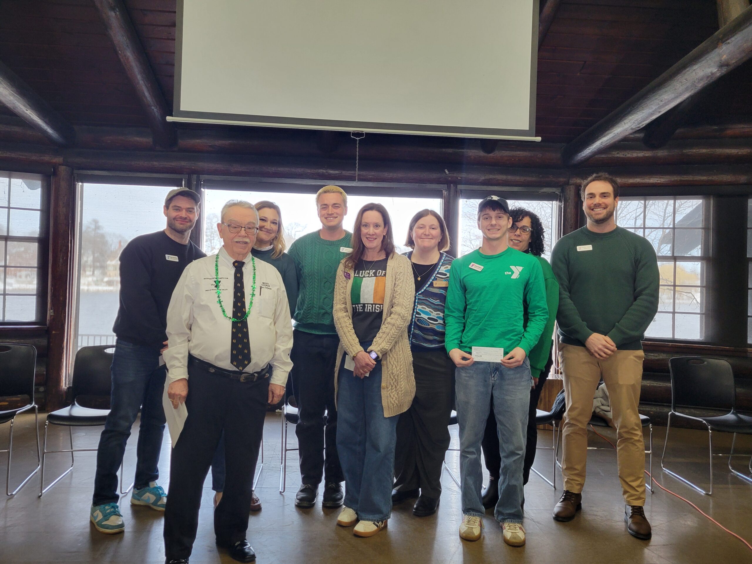 Grant recipients pose with member of retired men's club