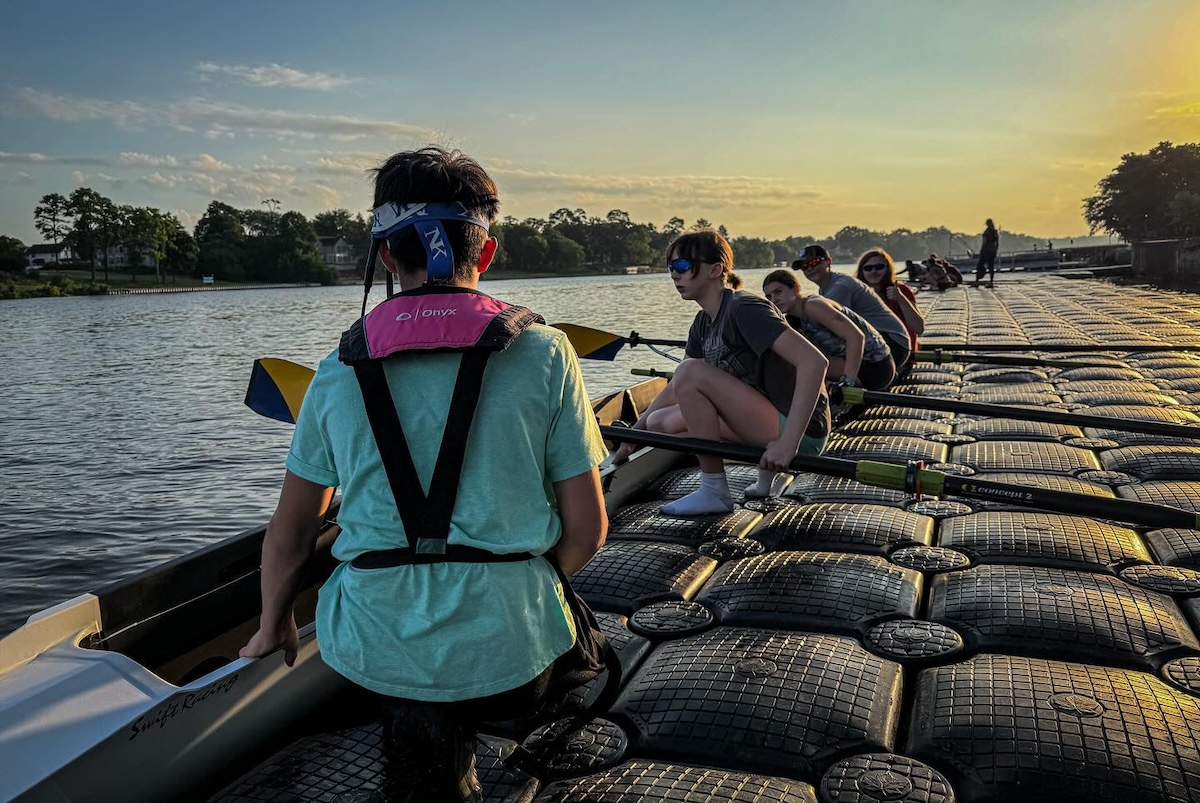 rowing dock Rowers on dock loading onto boat