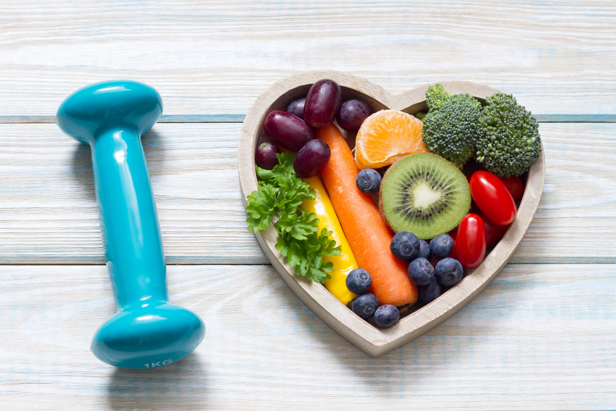 Image of a heart shaped plate with fruit and a 2lb weight