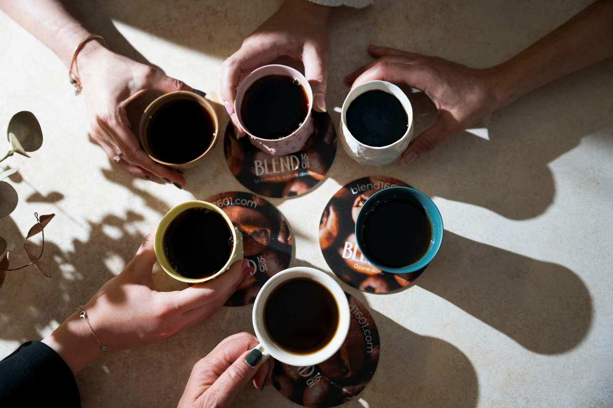 People holding coffee cups