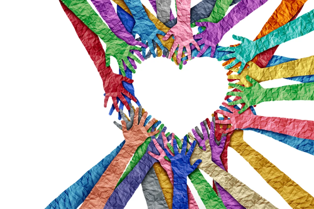 Colorful, textured hands reaching together to form a heart shape, symbolizing unity and diversity.